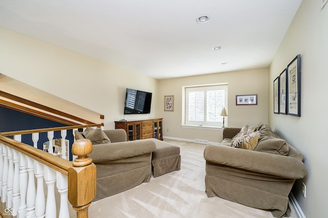 living room with light carpet, baseboards, visible vents, stairs, and recessed lighting