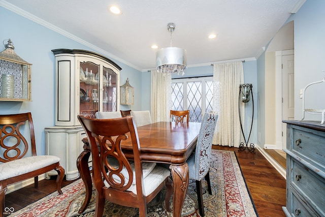 dining area featuring baseboards, dark wood-type flooring, recessed lighting, and crown molding