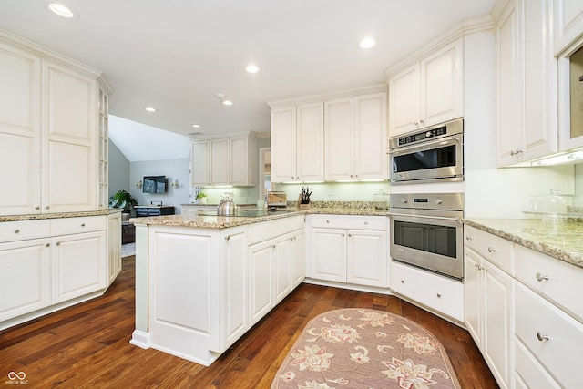 kitchen with light stone counters and white cabinets