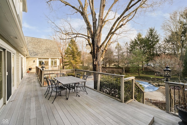 deck with outdoor dining area