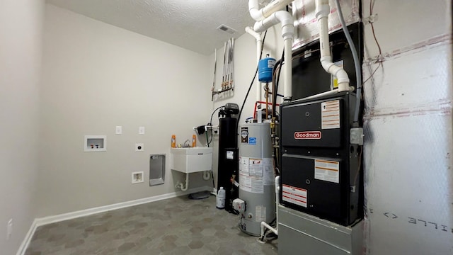 utility room featuring gas water heater