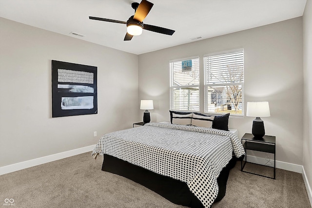 bedroom featuring carpet floors, visible vents, and baseboards