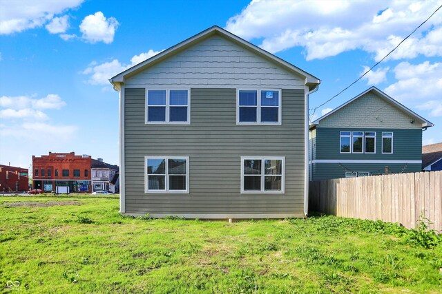 1624 Prospect St, Indianapolis, IN 46203 - rear view of property featuring a lawn and fence
