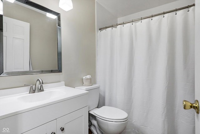 full bathroom featuring toilet and vanity