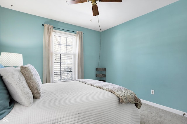 bedroom featuring carpet, baseboards, and ceiling fan