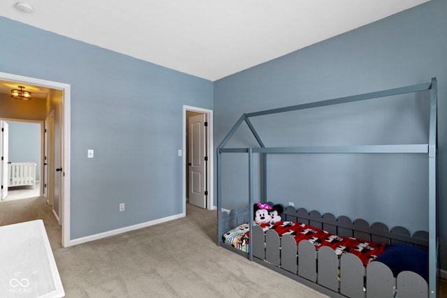 unfurnished bedroom featuring carpet and baseboards