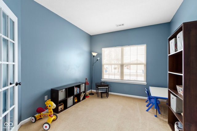 rec room featuring carpet floors, visible vents, and baseboards