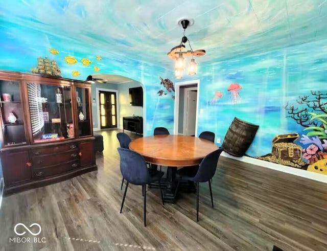 1046 Nelson Ave, Indianapolis, IN 46203 - dining room featuring wood finished floors and arched walkways