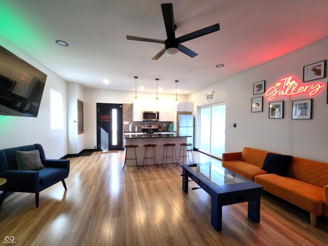 1046 Nelson Ave, Indianapolis, IN 46203 - living room featuring recessed lighting, ceiling fan, baseboards, and light wood-type flooring
