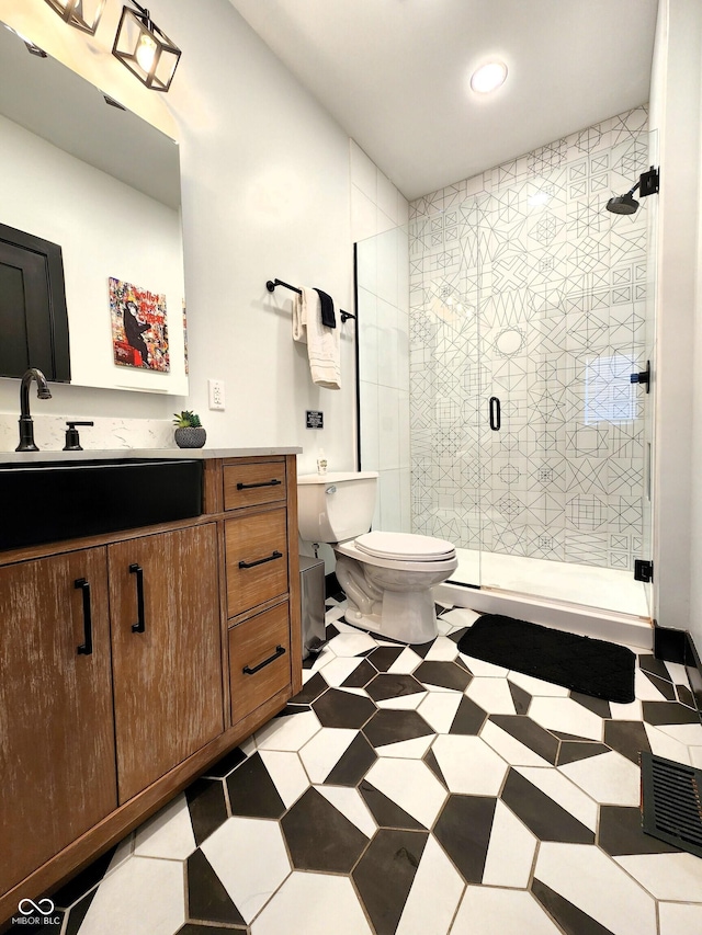 1046 Nelson Ave, Indianapolis, IN 46203 - full bathroom with recessed lighting, tile patterned floors, toilet, vanity, and a stall shower