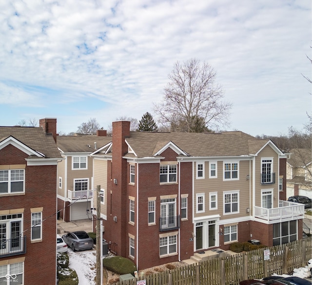 view of property featuring a fenced front yard and a residential view