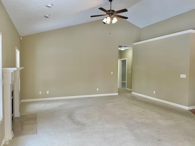 unfurnished living room featuring a fireplace with flush hearth, vaulted ceiling, baseboards, and a ceiling fan