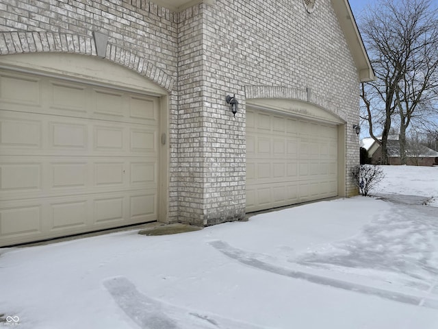 view of snow covered garage