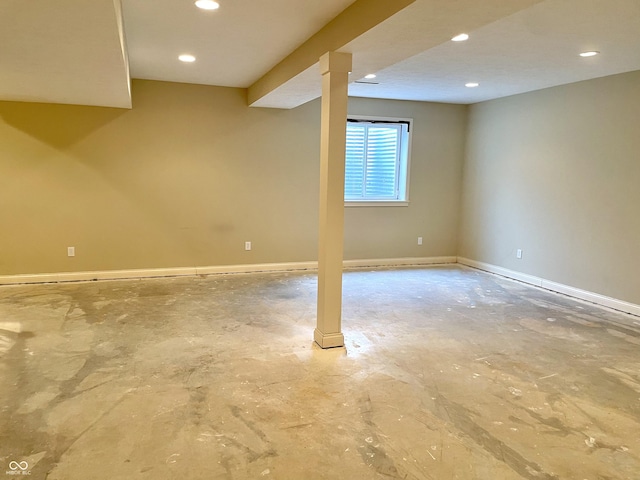 basement with baseboards and recessed lighting