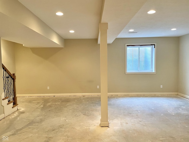 basement featuring recessed lighting, stairway, and baseboards