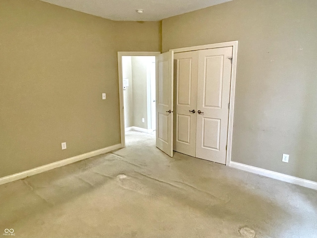 unfurnished bedroom featuring a closet and baseboards