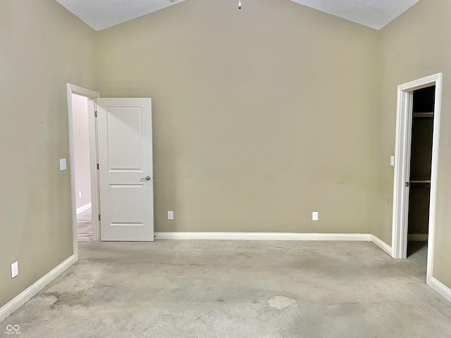 spare room featuring carpet and baseboards