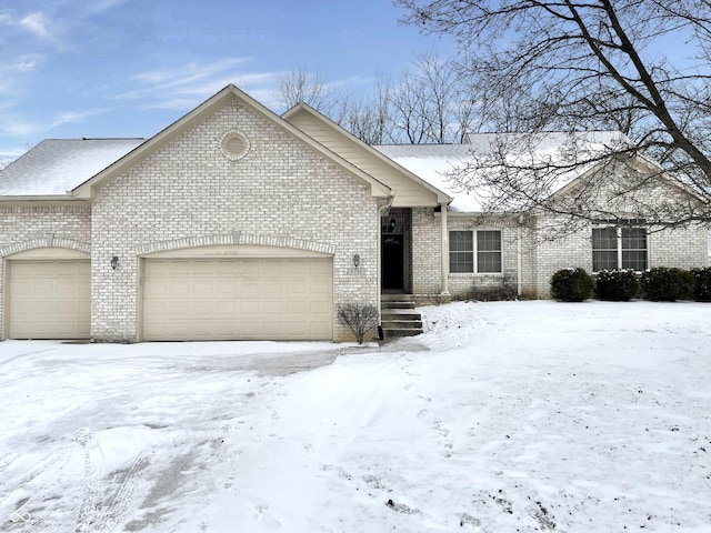 view of front of house with brick siding and an attached garage