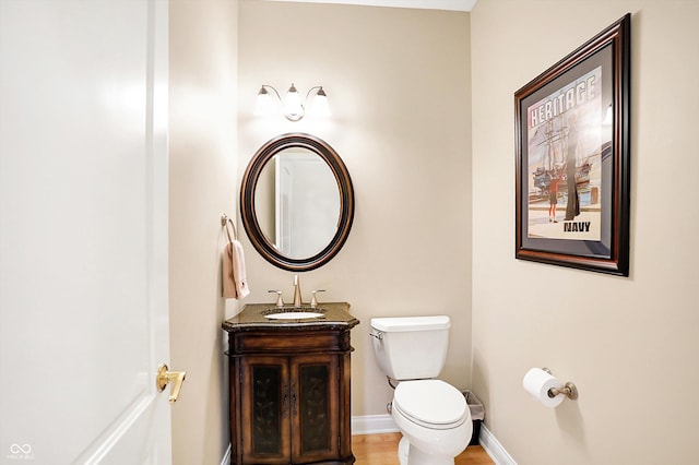 2110 Cheviot Ct, Greenwood, IN 46143 - bathroom featuring toilet, vanity, and baseboards