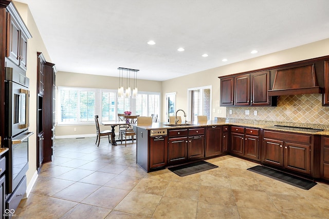 2110 Cheviot Ct, Greenwood, IN 46143 - kitchen with a sink, custom range hood, recessed lighting, a peninsula, and backsplash