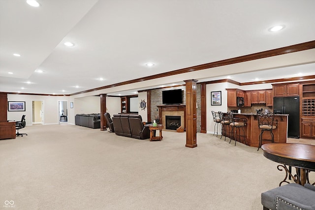 2110 Cheviot Ct, Greenwood, IN 46143 - living area with crown molding, light carpet, recessed lighting, baseboards, and bar with sink
