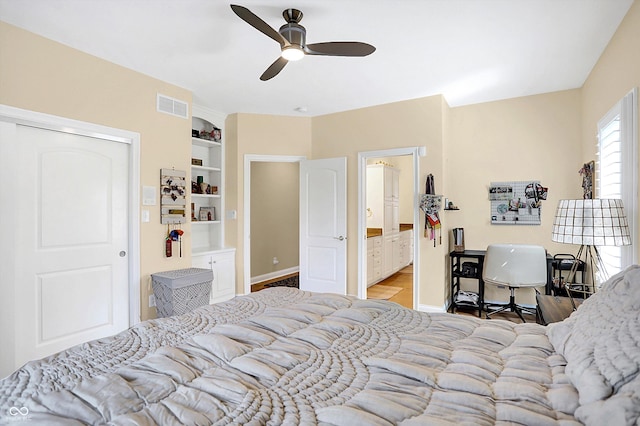 2110 Cheviot Ct, Greenwood, IN 46143 - bedroom featuring baseboards, wood finished floors, connected bathroom, and ceiling fan