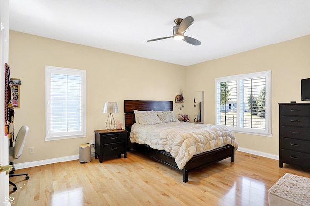 2110 Cheviot Ct, Greenwood, IN 46143 - bedroom featuring light wood finished floors, baseboards, and ceiling fan