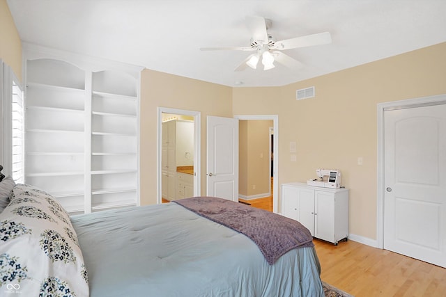 2110 Cheviot Ct, Greenwood, IN 46143 - bedroom with light wood finished floors, baseboards, a ceiling fan, and connected bathroom