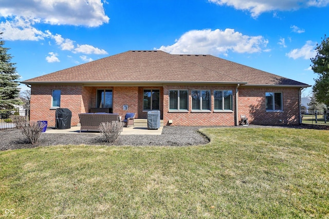 2110 Cheviot Ct, Greenwood, IN 46143 - rear view of house with a patio area, brick siding, an outdoor living space, and a shingled roof