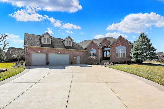 2110 Cheviot Ct, Greenwood, IN 46143 - traditional-style house with brick siding, a front lawn, driveway, an attached garage, and a shingled roof
