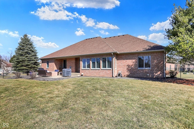 2110 Cheviot Ct, Greenwood, IN 46143 - rear view of house featuring a patio, brick siding, a shingled roof, and an outdoor living space