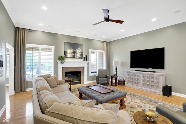 2110 Cheviot Ct, Greenwood, IN 46143 - living area featuring a ceiling fan, a tiled fireplace, wood finished floors, baseboards, and recessed lighting