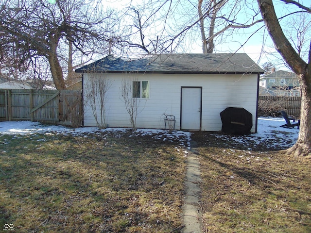 view of outbuilding featuring fence