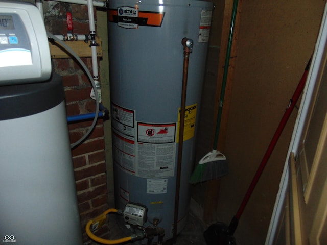 utility room featuring water heater