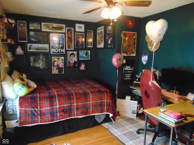 bedroom featuring wood finished floors