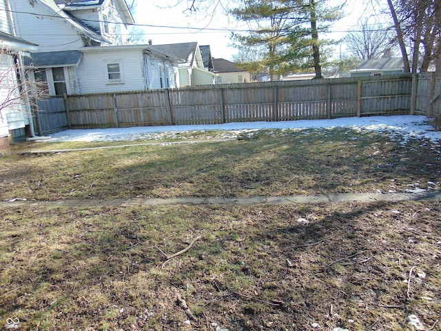 view of yard featuring a patio area and a fenced backyard