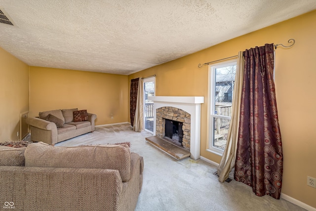 living area with visible vents, a fireplace, baseboards, and carpet floors