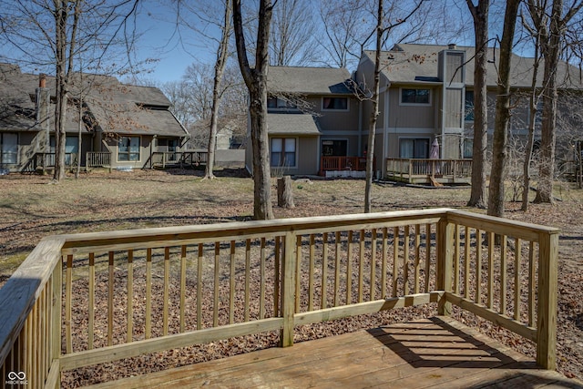 wooden terrace with a residential view