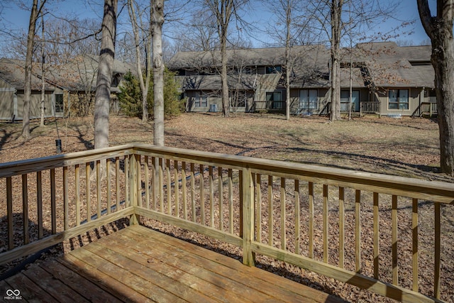 wooden deck featuring a residential view