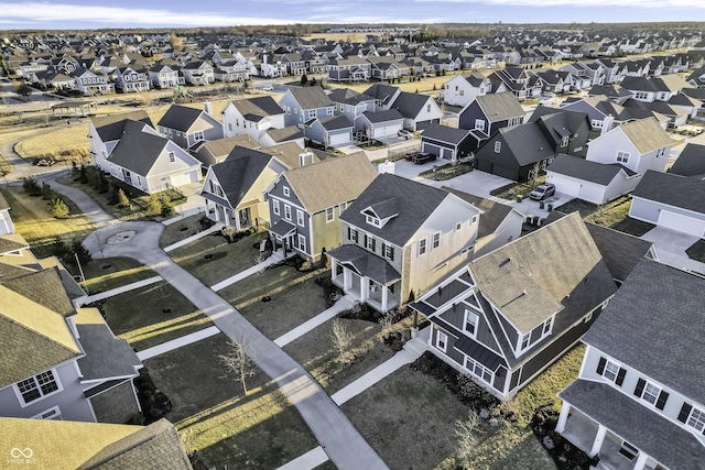 birds eye view of property with a residential view