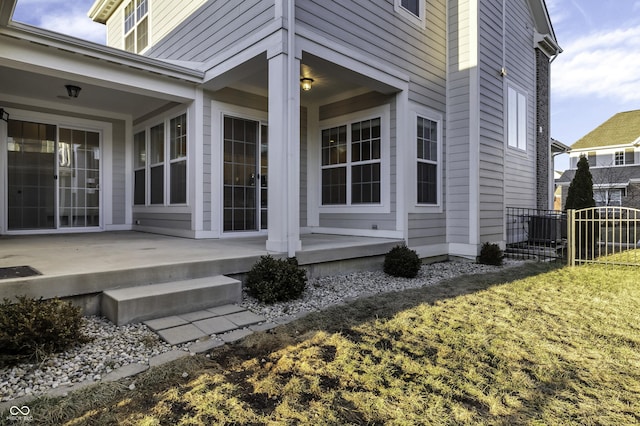 view of property exterior with a patio area