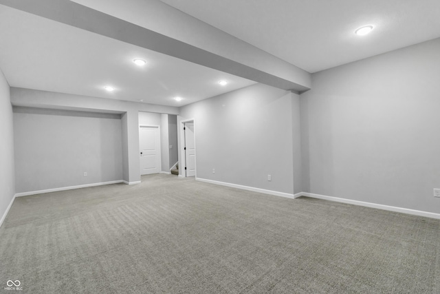 below grade area with recessed lighting, baseboards, and carpet floors