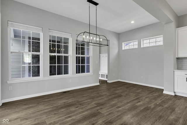 unfurnished dining area with recessed lighting, baseboards, and dark wood-style floors