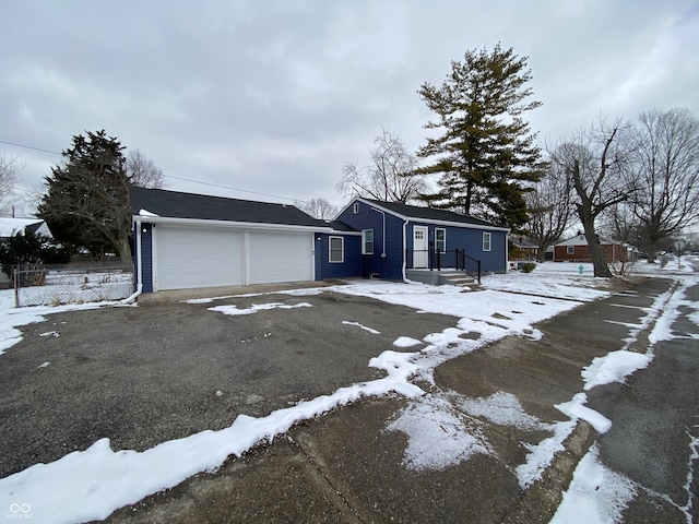 view of front of property featuring an attached garage and driveway