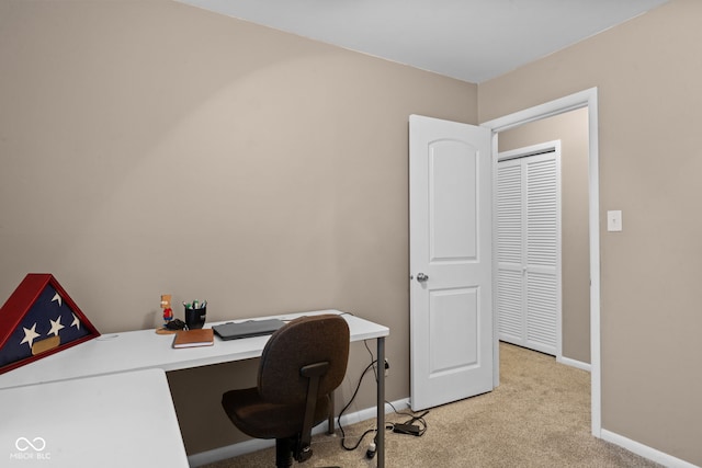 home office featuring light colored carpet and baseboards