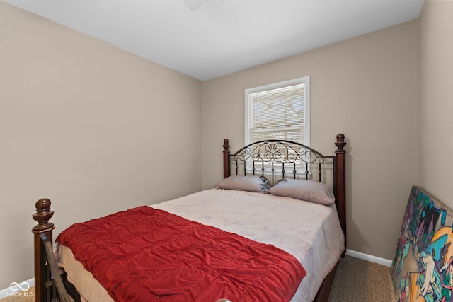 bedroom featuring carpet and baseboards