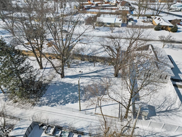 snowy aerial view featuring a residential view