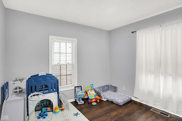 playroom featuring visible vents and wood finished floors