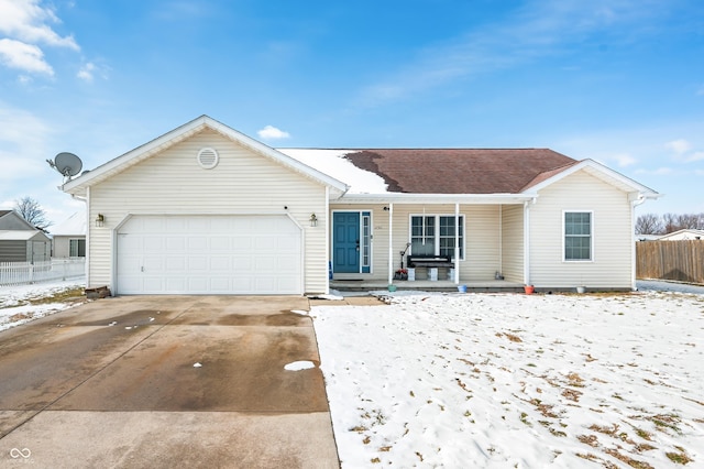 ranch-style home with a garage, driveway, covered porch, and fence