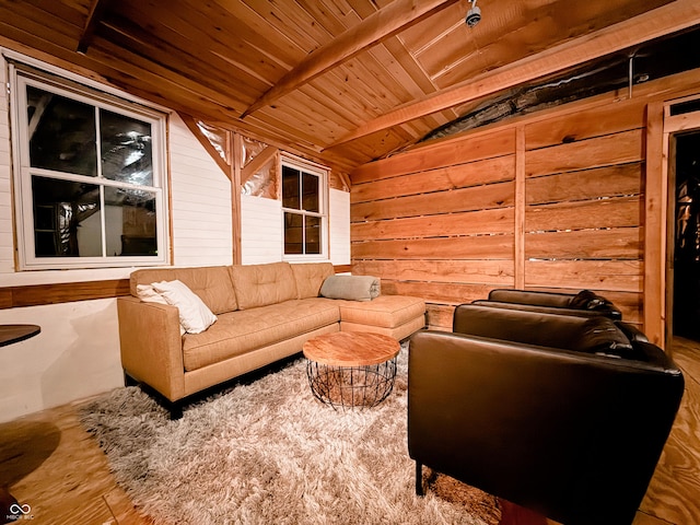 living room featuring lofted ceiling with beams, wood walls, and wood ceiling